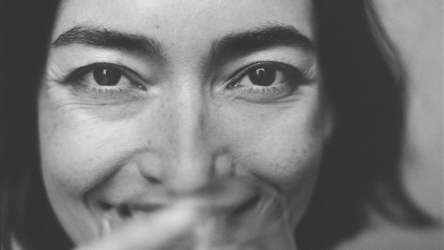 Close-up of a person's face with a blurred background