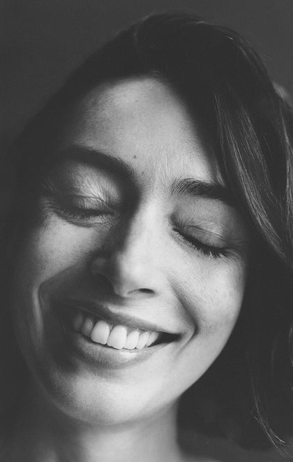 Black and white close-up of a person with a blurred background
