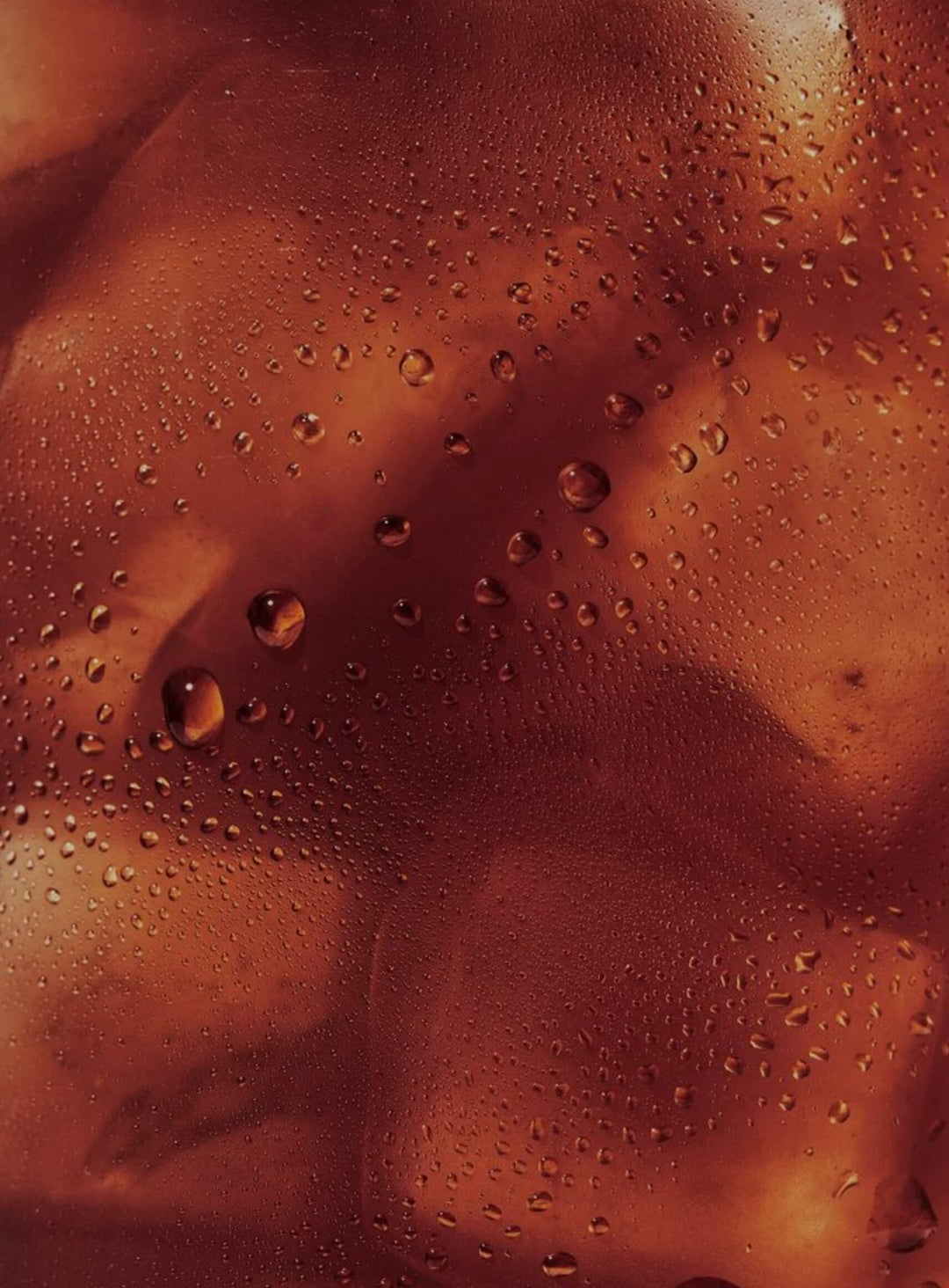Close-up of a textured brown surface with water droplets