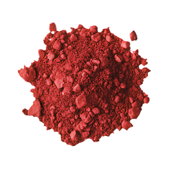 Clear plastic cup with red liquid on a red background